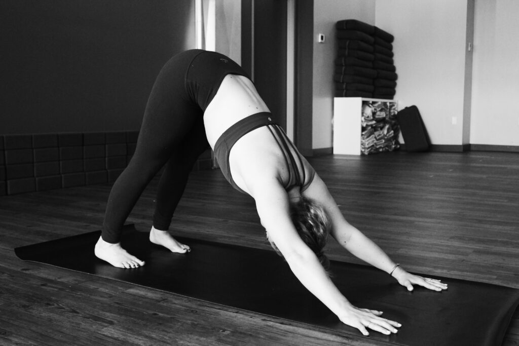 Woman doing yoga_master your menstrual cycle
