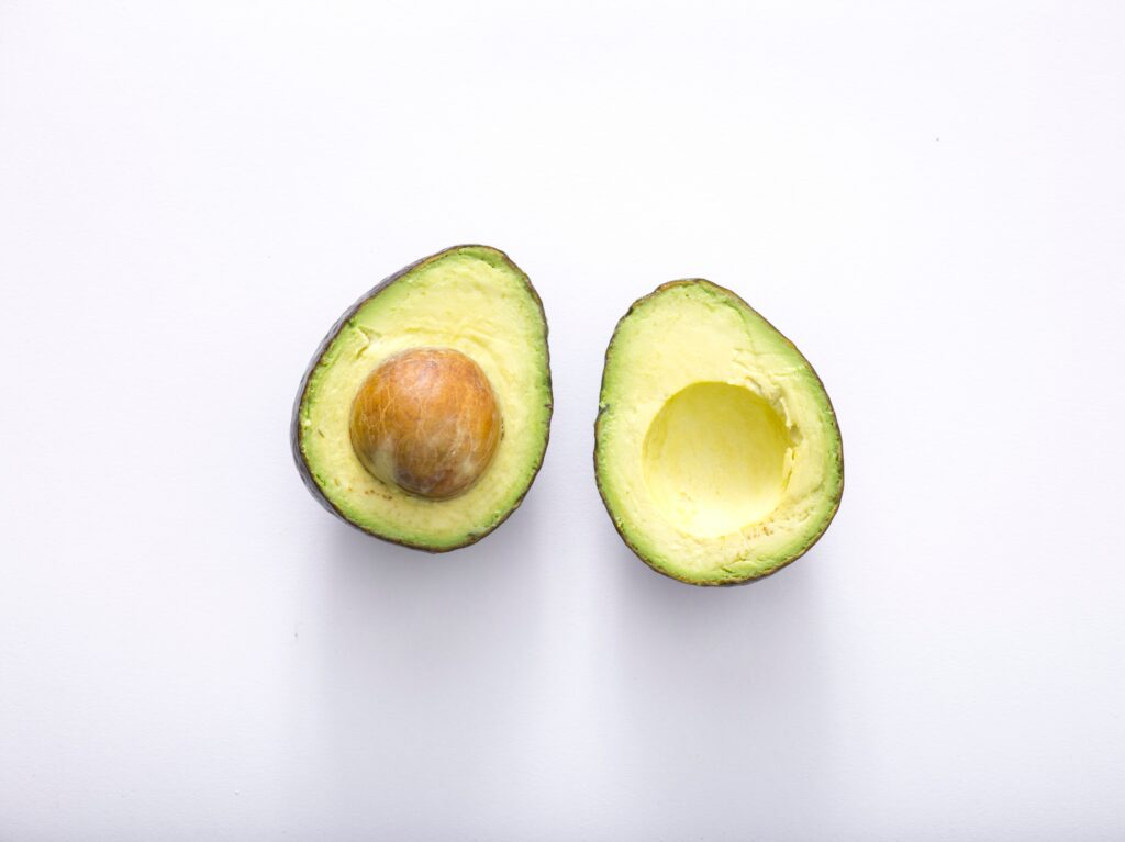 Avocado cut in half_healthy fats for clear skin