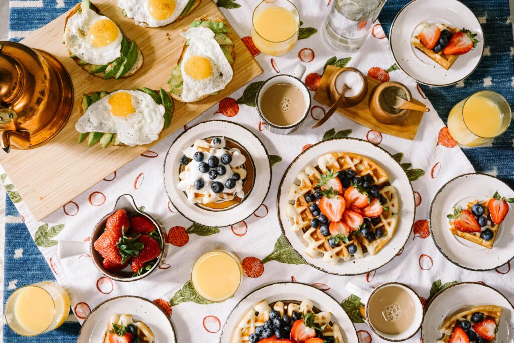 Breakfast spread of fruit and waffles_what you eat for breakfast is important for hormone health