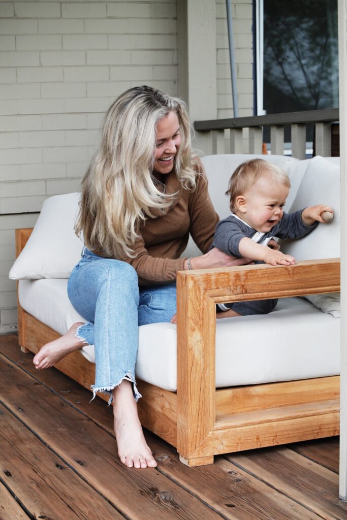 Edie and baby on front porch_postpartum hormone balance