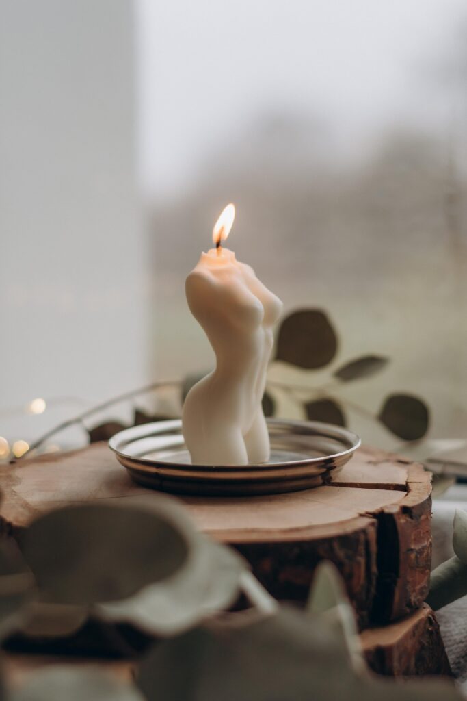candle shaped like woman's body_how to feel better on your period