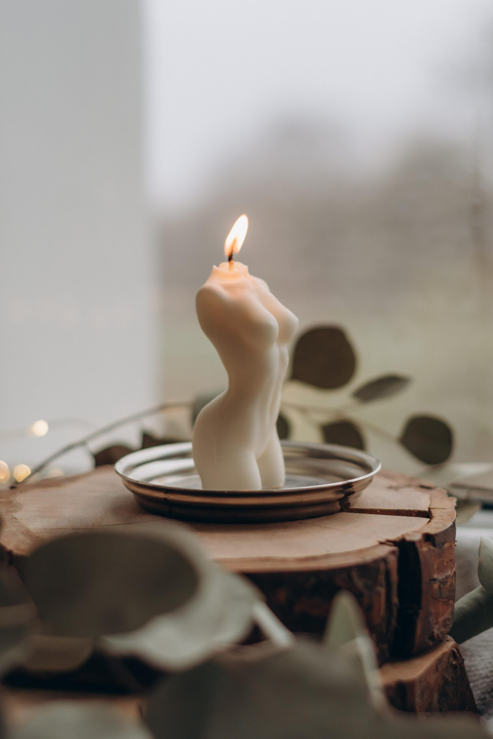 candle shaped like woman's body_fertility tracker device